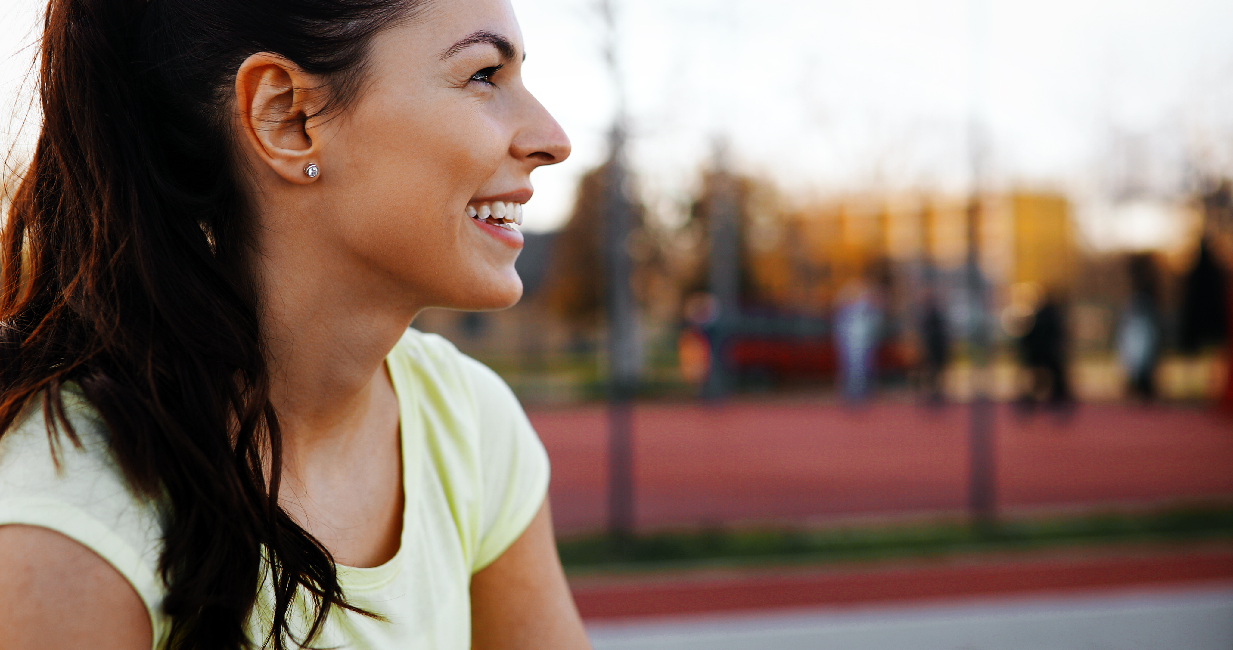 Beautiful female jogger tired after running